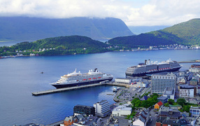 Large cruise ships stand on the shore, Norway