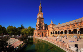 Tower on the banks of the water channel of the city of Seville, Spain