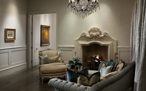 Beautiful fireplace with armchairs in the living room