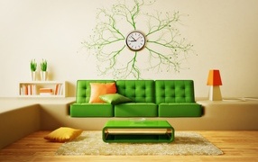 Green sofa in a room with a clock