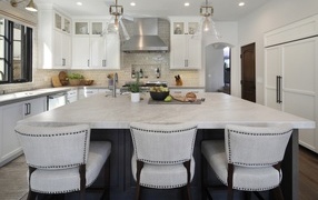 Large table with chairs in bright kitchen