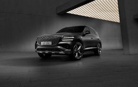 Черный автомобиль  Genesis GV80 AWD в здании