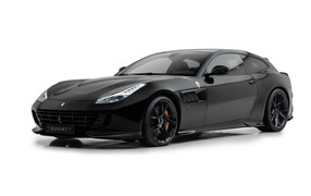Черный автомобиль Mansory Ferrari GTC4Lusso 2024 года на белом фоне