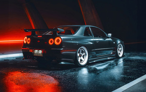 Черный автомобиль Nissan Skyline GTR R35 вид сзади