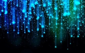 Яркие искры летят вниз на черном фоне