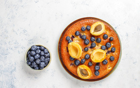 Sweet pie with apricots and blueberries