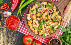 Baked chicken with spices and sauce on the table