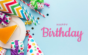 Multicolored festive decor with cake on a blue background for Birthday
