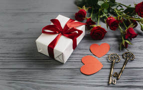 Gift, bouquet of roses and keys for your beloved on Valentine's Day