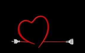 Красное сердце из провода на черном фоне