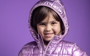 Smiling girl in a lilac jacket