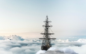 Большой парусный корабль плывет по облакам