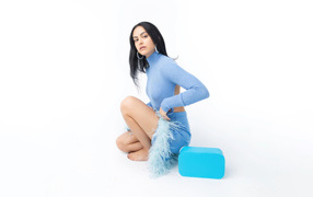 Actress Camila Mendes on a white background