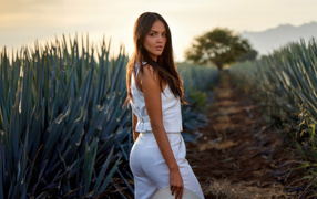 Beautiful girl actress Eiza Gonzalez in a white suit