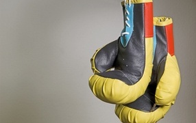 Boxing gloves on a background of a gray wall