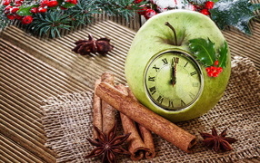 Зеленое яблоко с часами на столе со специями