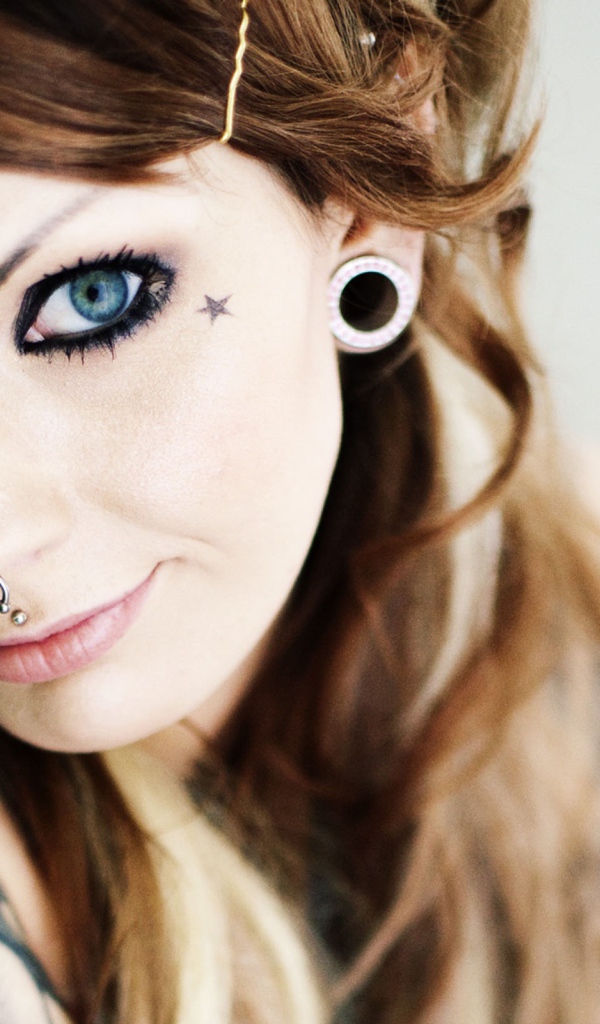 Girl with tattoos and piercings