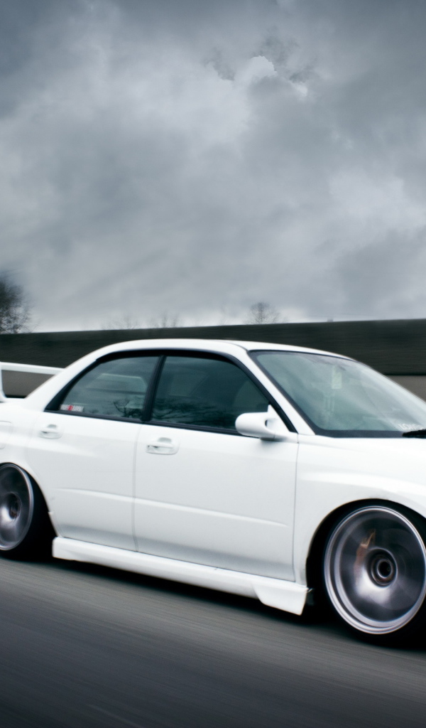 white Subaru Impreza STI