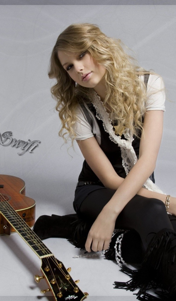 Тейлор с гитарой