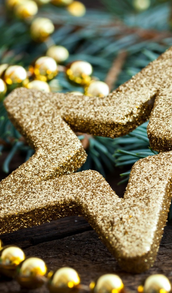 Ёлочная игрушка золотого цвета