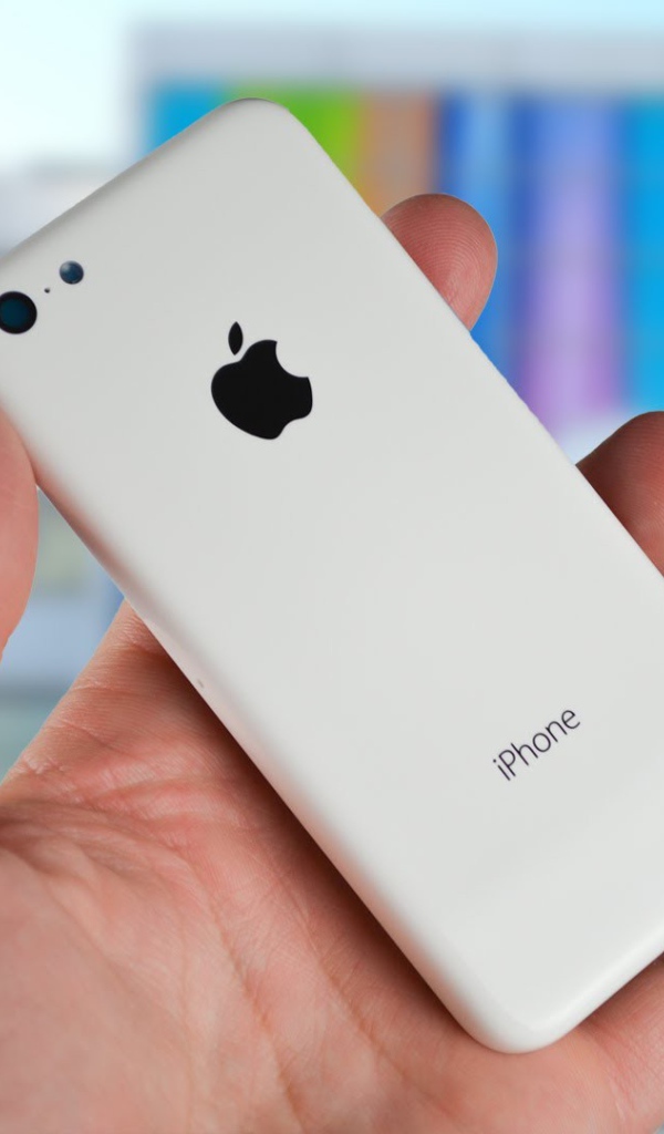 Новый белый Iphone 5C в руке