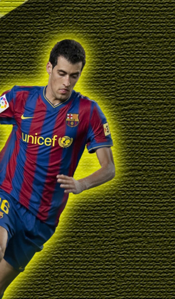 Футболист Барселоны Серхио Бускетс на желтом фоне