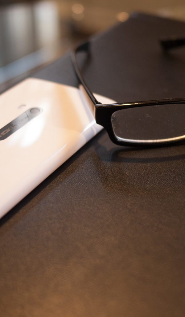 White Nokia Lumia 920 and glasses