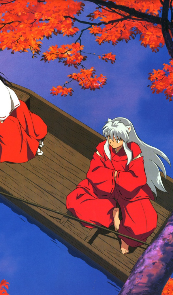 Две девочки в лодке осенью