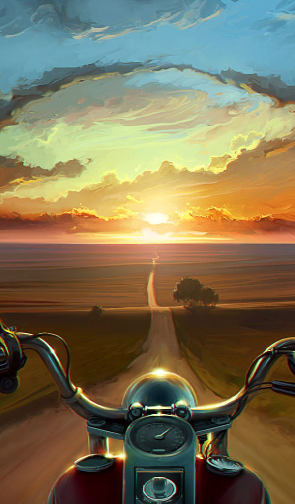 Мотоциклист едет на закат
