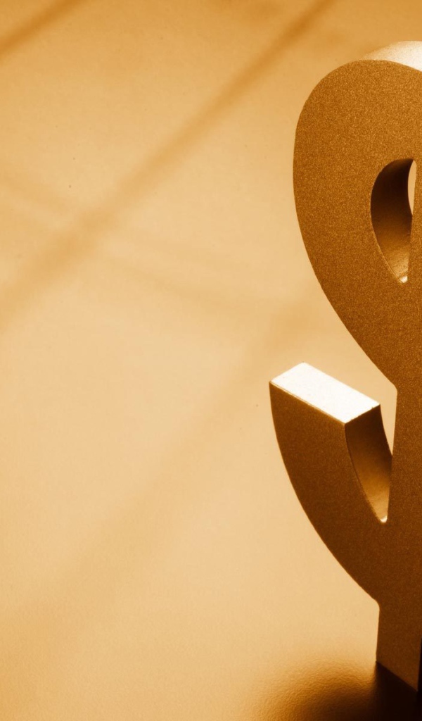 Металлический знак доллара