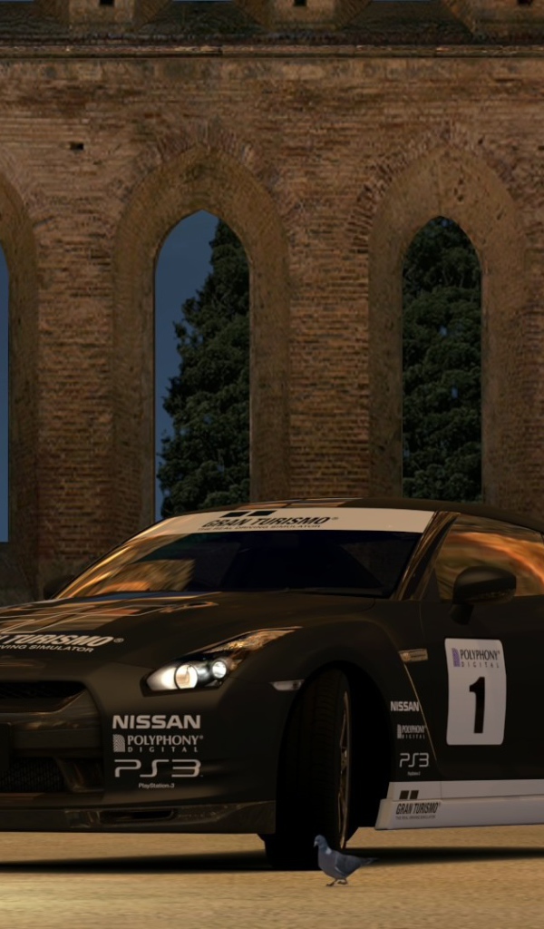 Гонщик у своей машины