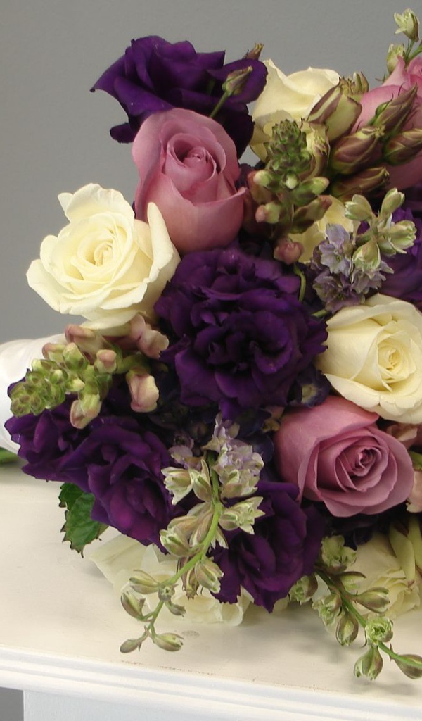 Purple roses in a beautiful wedding bouquet