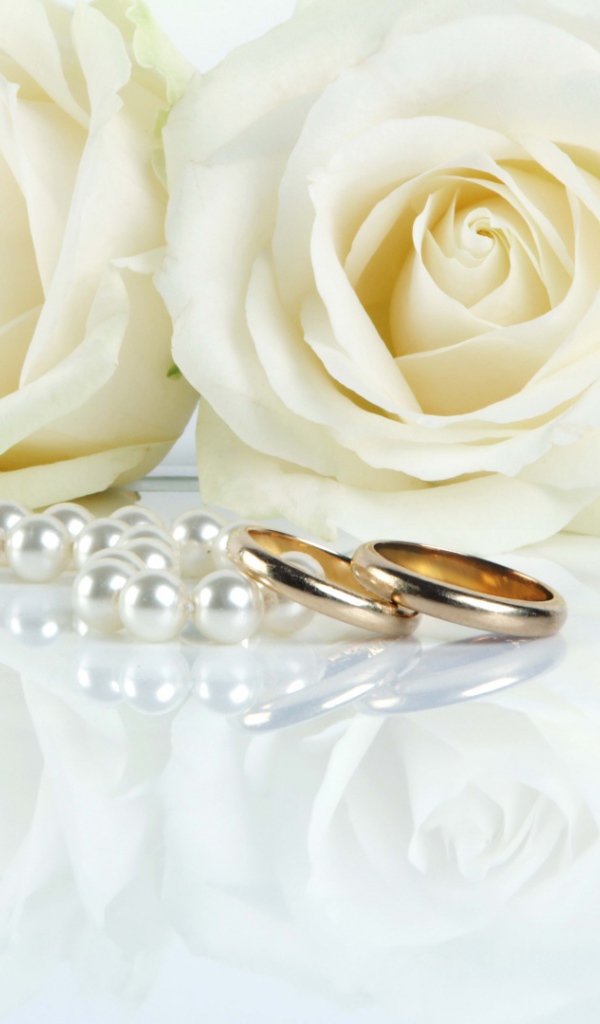 White roses and wedding rings