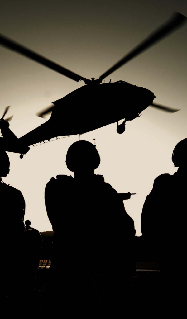 Three SWAT on the background of the helicopter