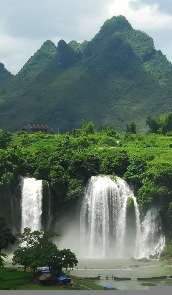 Дом и мост под водопадом