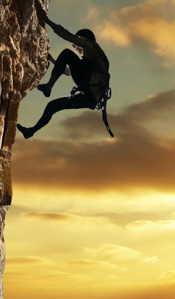 Человек лезет на скалу