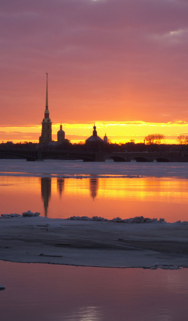 Snow in St. Petersburg sunset on the waterfront