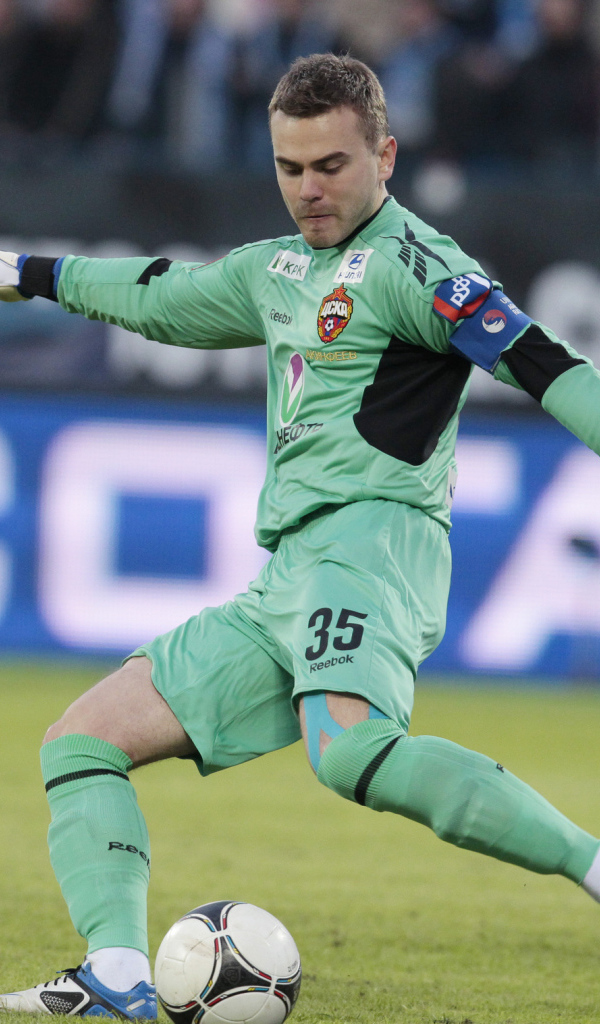CSKA goalkeeper Igor Akinfeev hits the ball