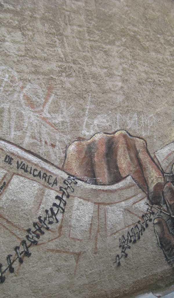 Рисунок мужчины в очках на стене