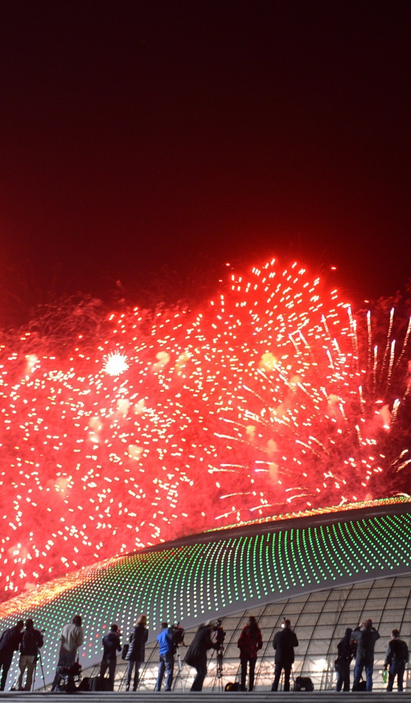 Fireworks over the roof of the stadium at the opening of the Olympic Games in Sochi