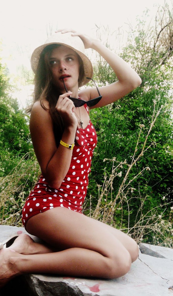 Girl in bathing suit with polka dots