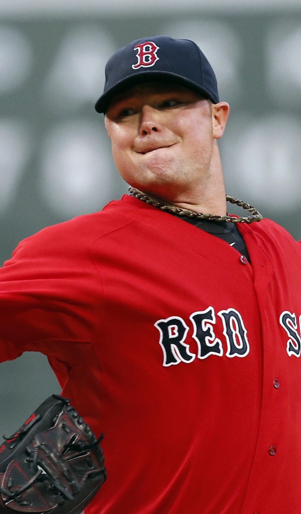 Джон Лестер бросает бейсбольный мяч