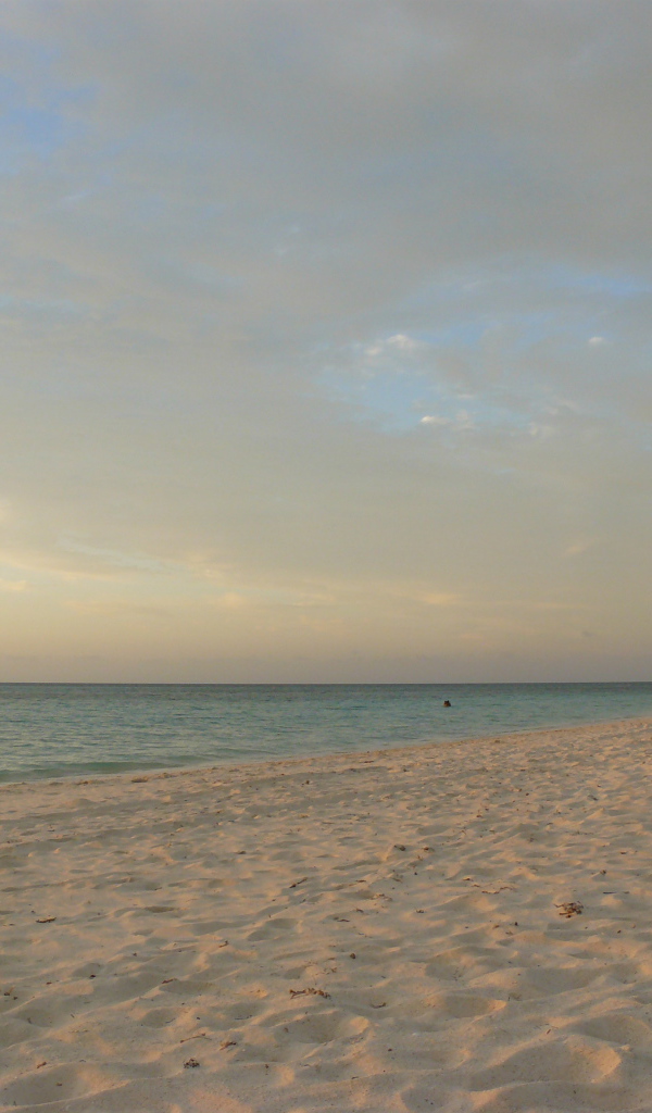 Закат на пляже на курорте Гуардалавака, Куба