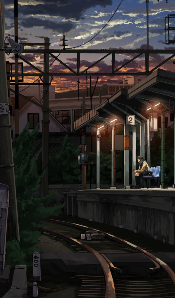 Одинокий парень на железнодорожной станции