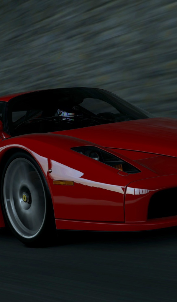 Красный Ferrari Enzo мчится на черном фоне