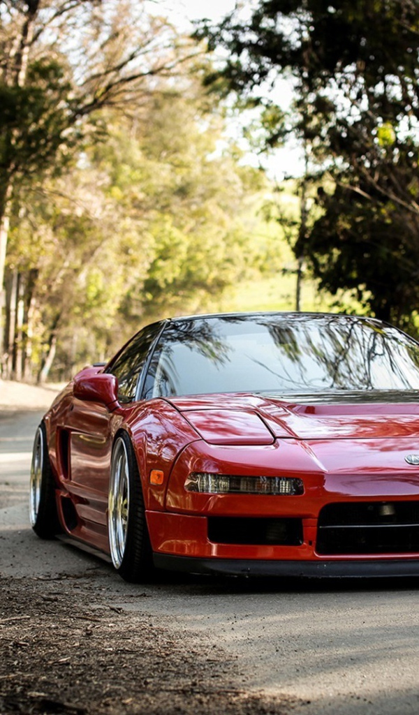 Блестящая красная Хонда Acura NSX