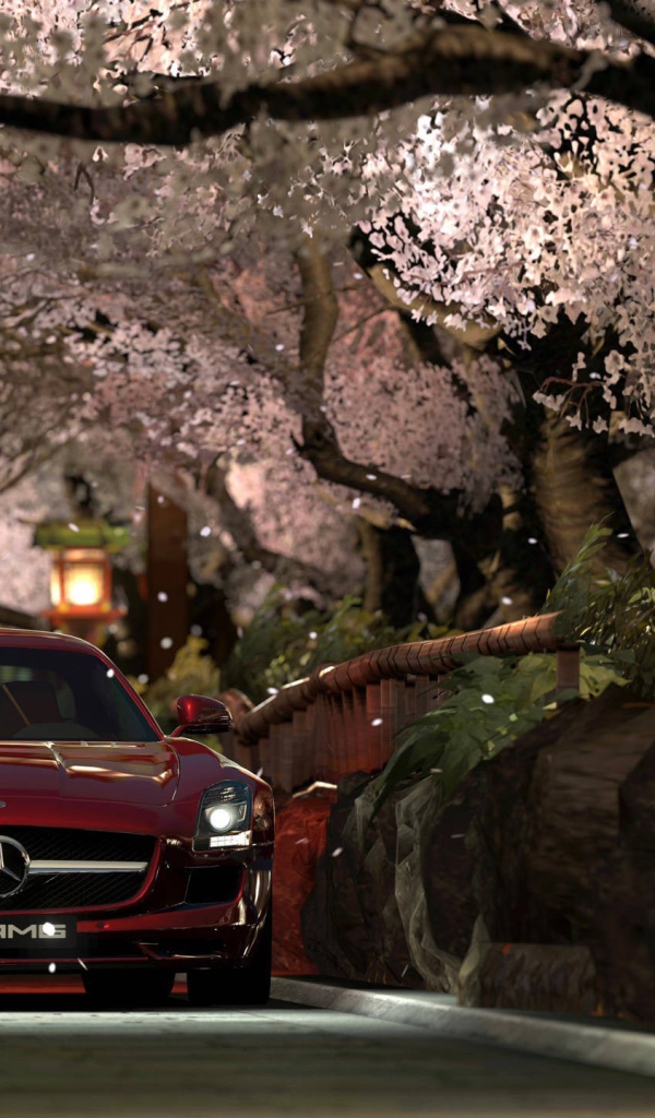 Красный Мерседес Gran Turismo под сенью сакуры