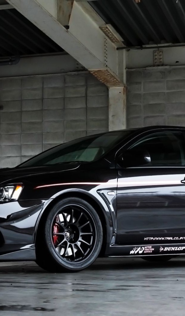 Black Mitsubishi Lancer Evo X in the garage