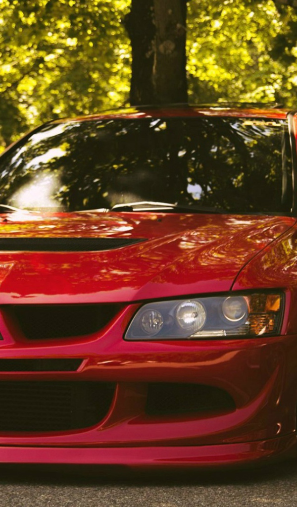 Красный Mitsubishi Lancer Evolution IX