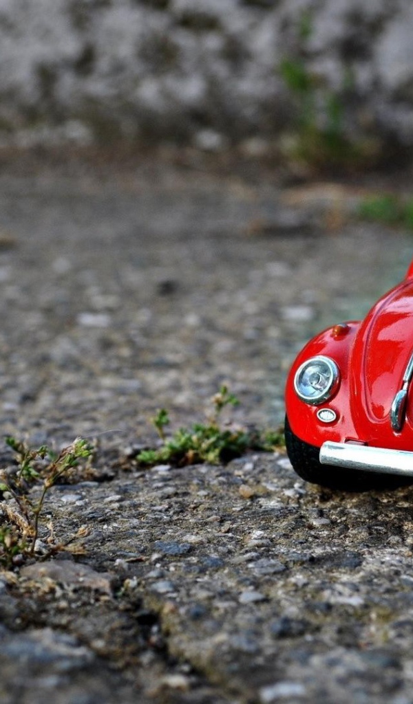 Модель красного автомобиля Volkswagen Beetle